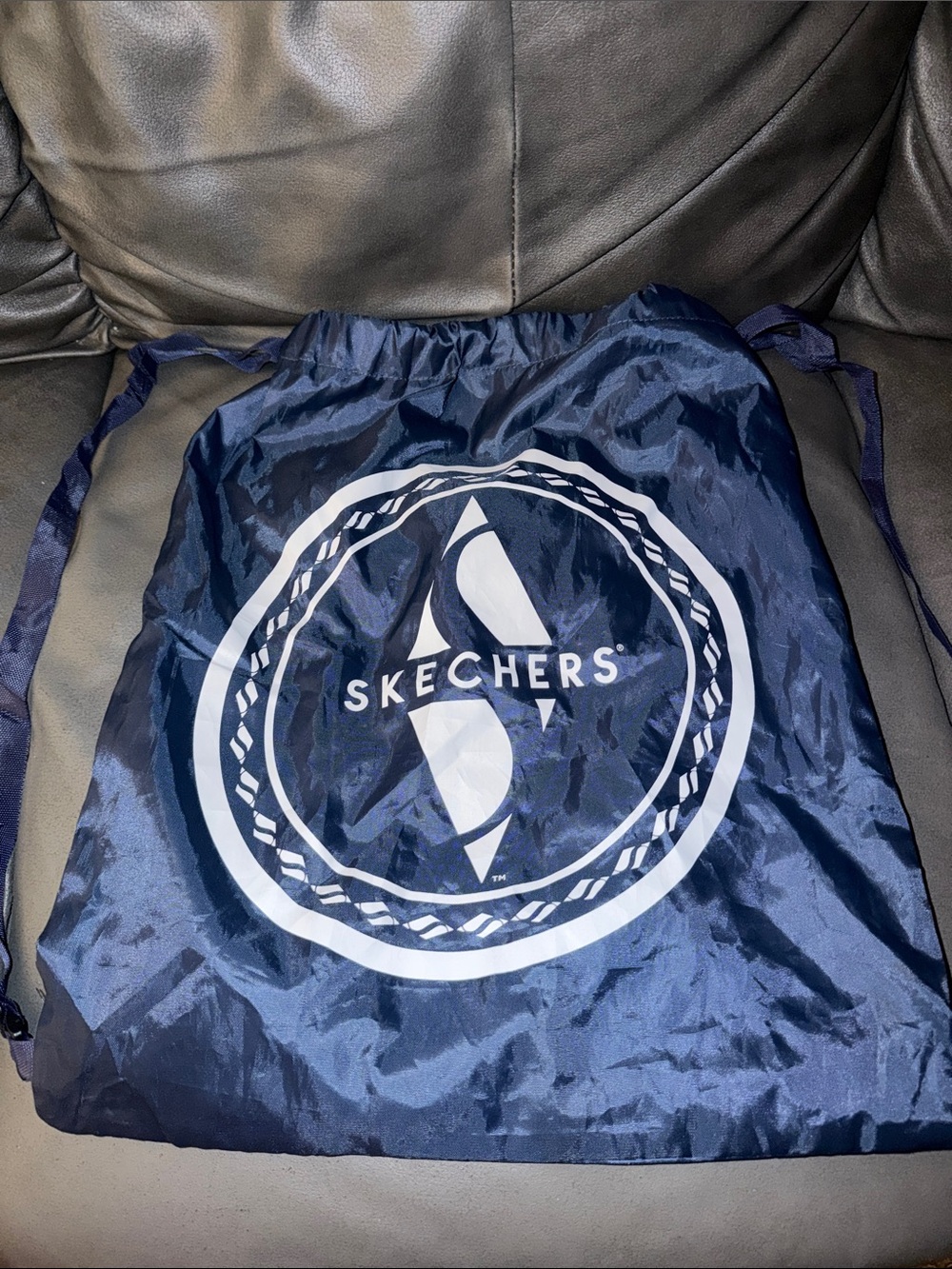 Skechers Navy Drawstring Logo Backpack with mystery items inside always